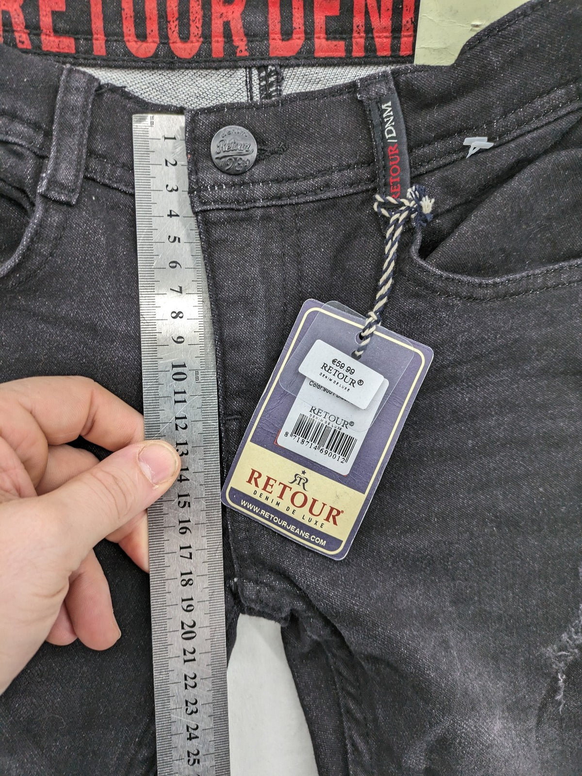 Skinny black straight jeans with distressed details and logo, made from durable denim.
