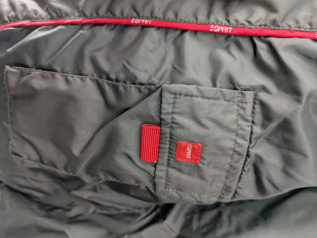 Esprit brown puffer vest with high ribbed collar and zip button closure.