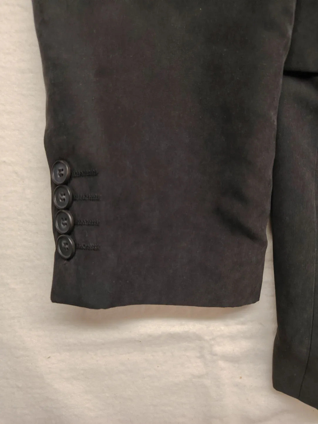 dunmore black blazer two-button design with falling lapels and multiple pockets