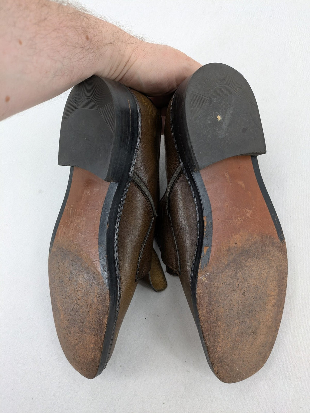 Fonda brown deck shoes genuine leather square toe design with decorative stitching.