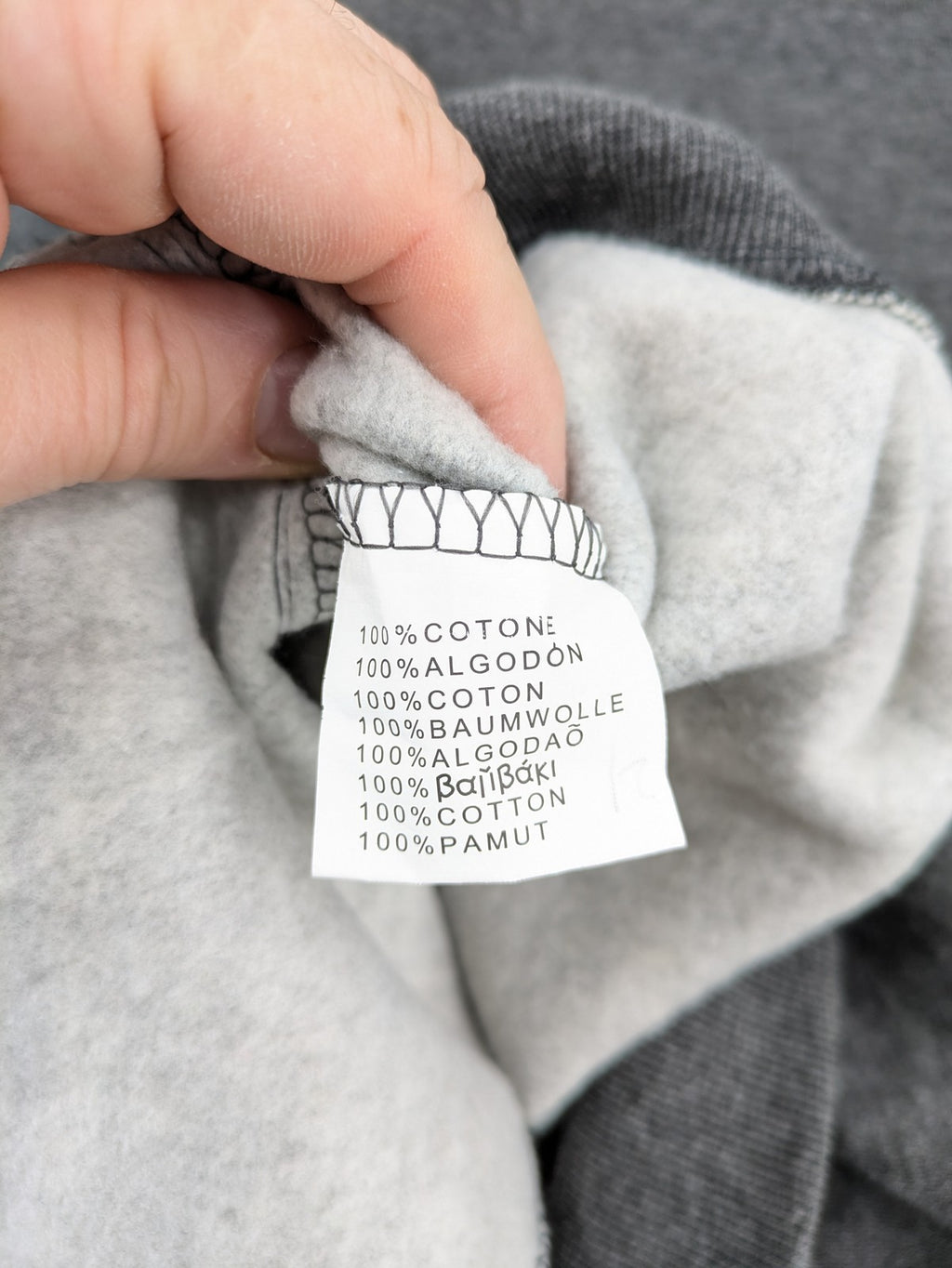 Bolf grey hoodie with pink contrast hood, kangaroo pocket, and ribbed cuffs.