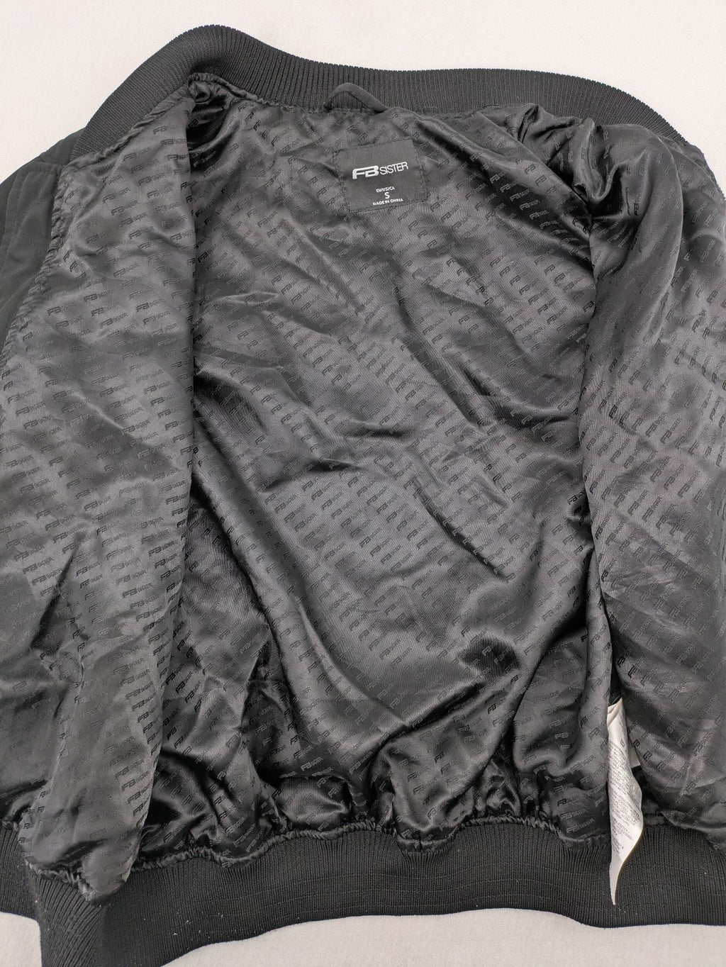 FB Sister grey bomber jacket with full zip, ribbed cuffs, and smooth polyester material.