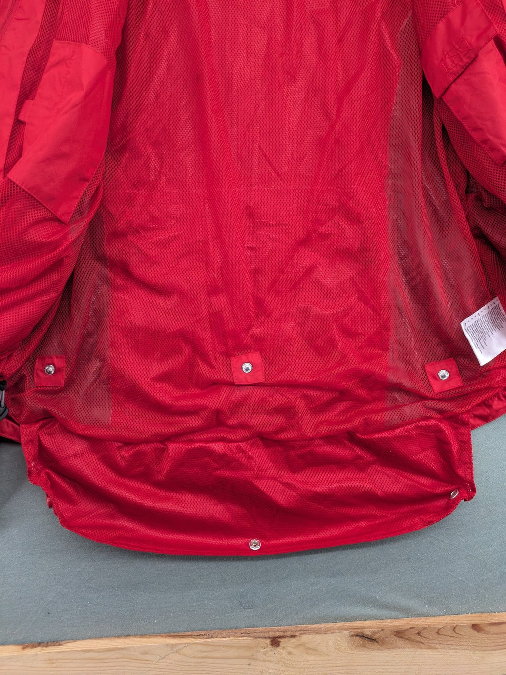 Movement Session grey and red windbreaker jacket with colorblock pattern and full zip.