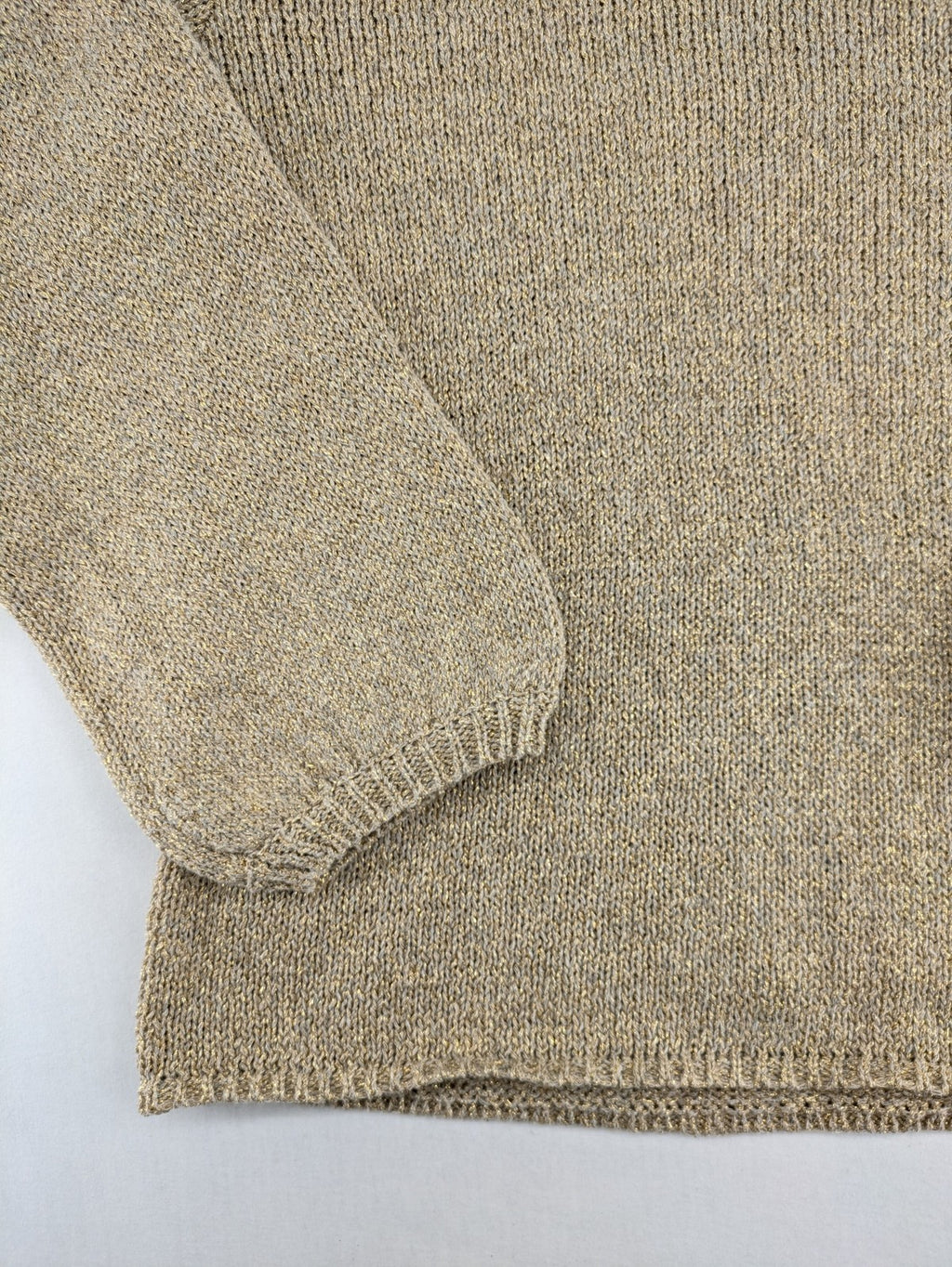 Rick Cardona beige turtle neck jumper with gold metallic thread and balloon sleeves.