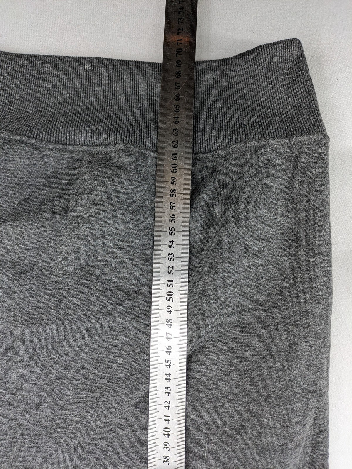 Bolf grey hoodie with pink contrast hood, kangaroo pocket, and ribbed cuffs.
