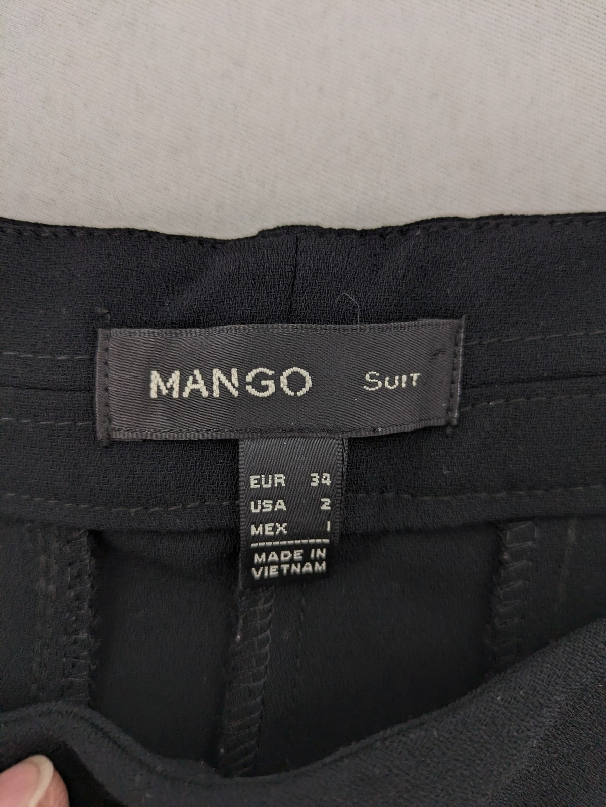 Mango Suit black trousers with zipper, belt loops, and front slant pockets.