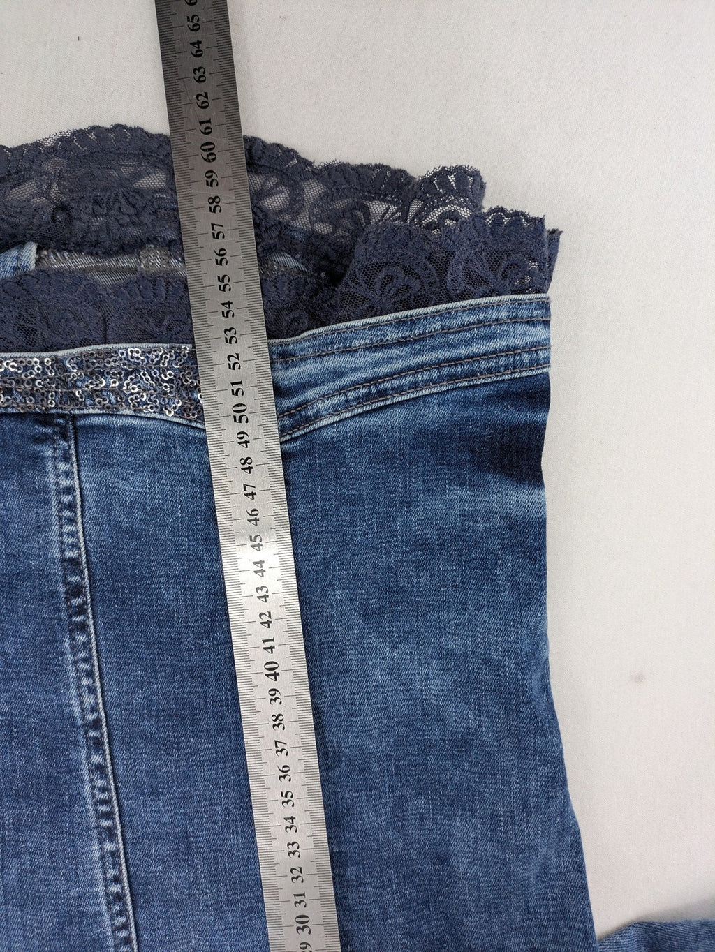 TREDY blue denim jacket with sequins, lace trim, and fitted design.