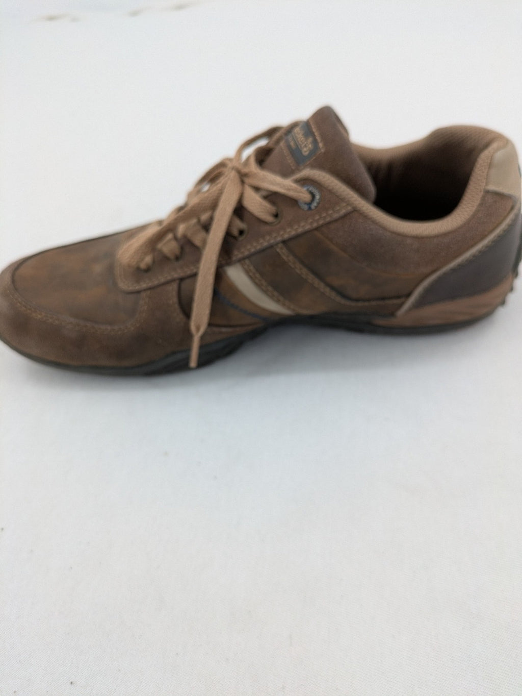 Dockers brown sneakers with subtle light brown and blue accents, lace-up design.