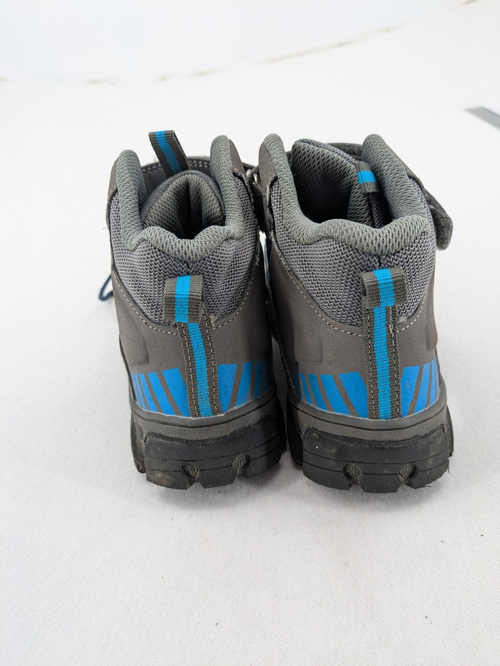 Outdoor grey and blue winter boots with high shaft, Velcro closure, and textured sole.