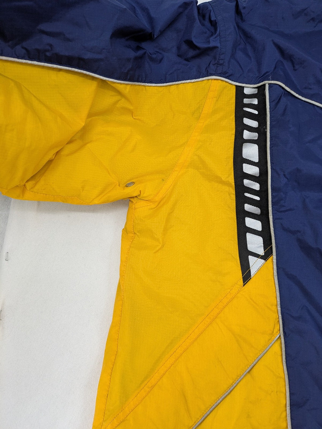 Shamp navy and yellow vintage ski jacket and pants set with retro design.