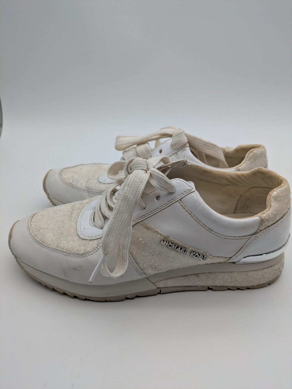 Michael Kors multi sneaker white leather and cream textile with silver logo details.