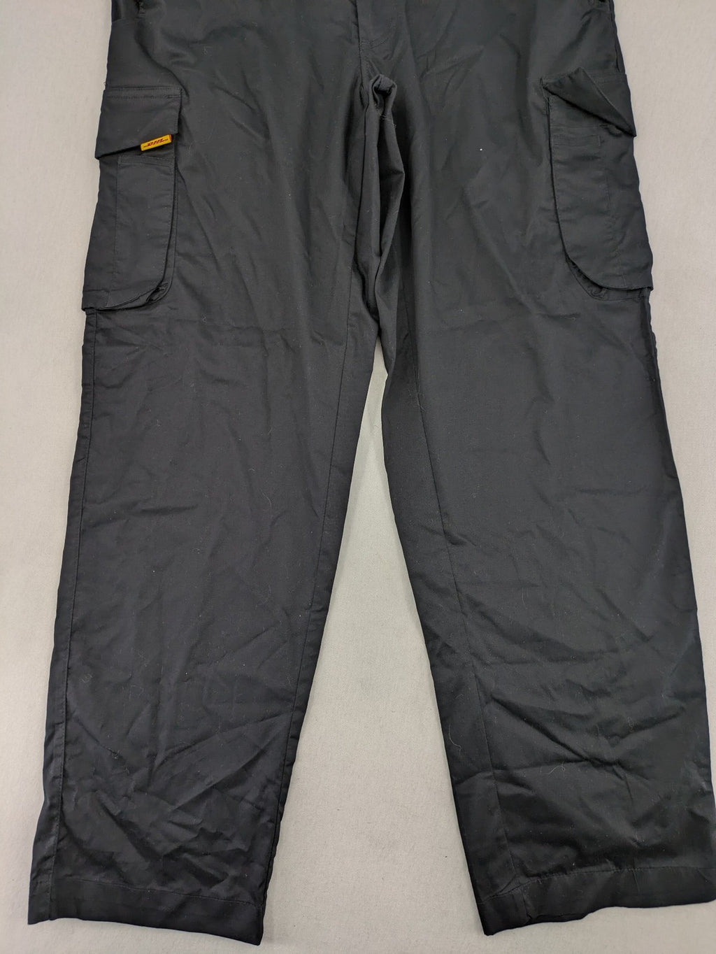 DHL grey cargo pants with iconic logo and multiple pockets, made from stretch cotton.