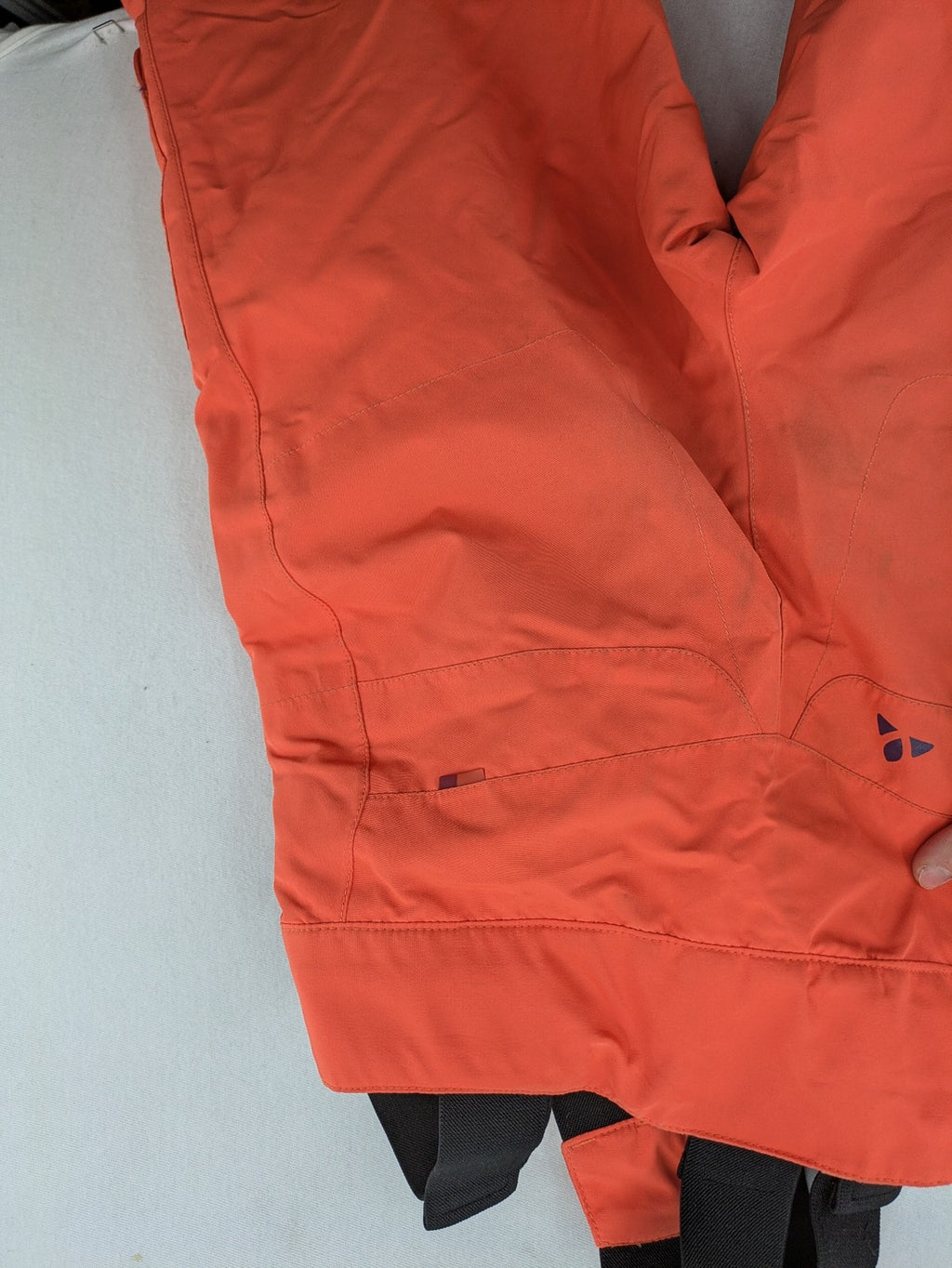 Vaude orange ski pants with logo, Primaloft insulation, and Ceplex Active membrane.