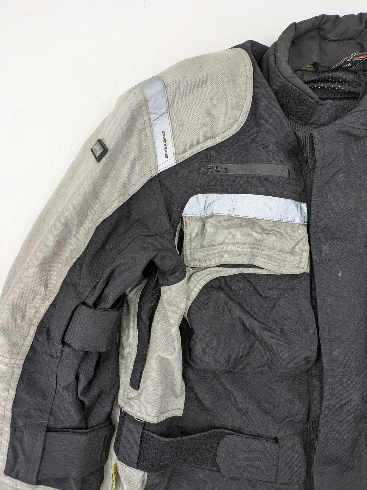Polo motorcycle jacket cream durable Cordura fabric multiple pockets adjustable straps