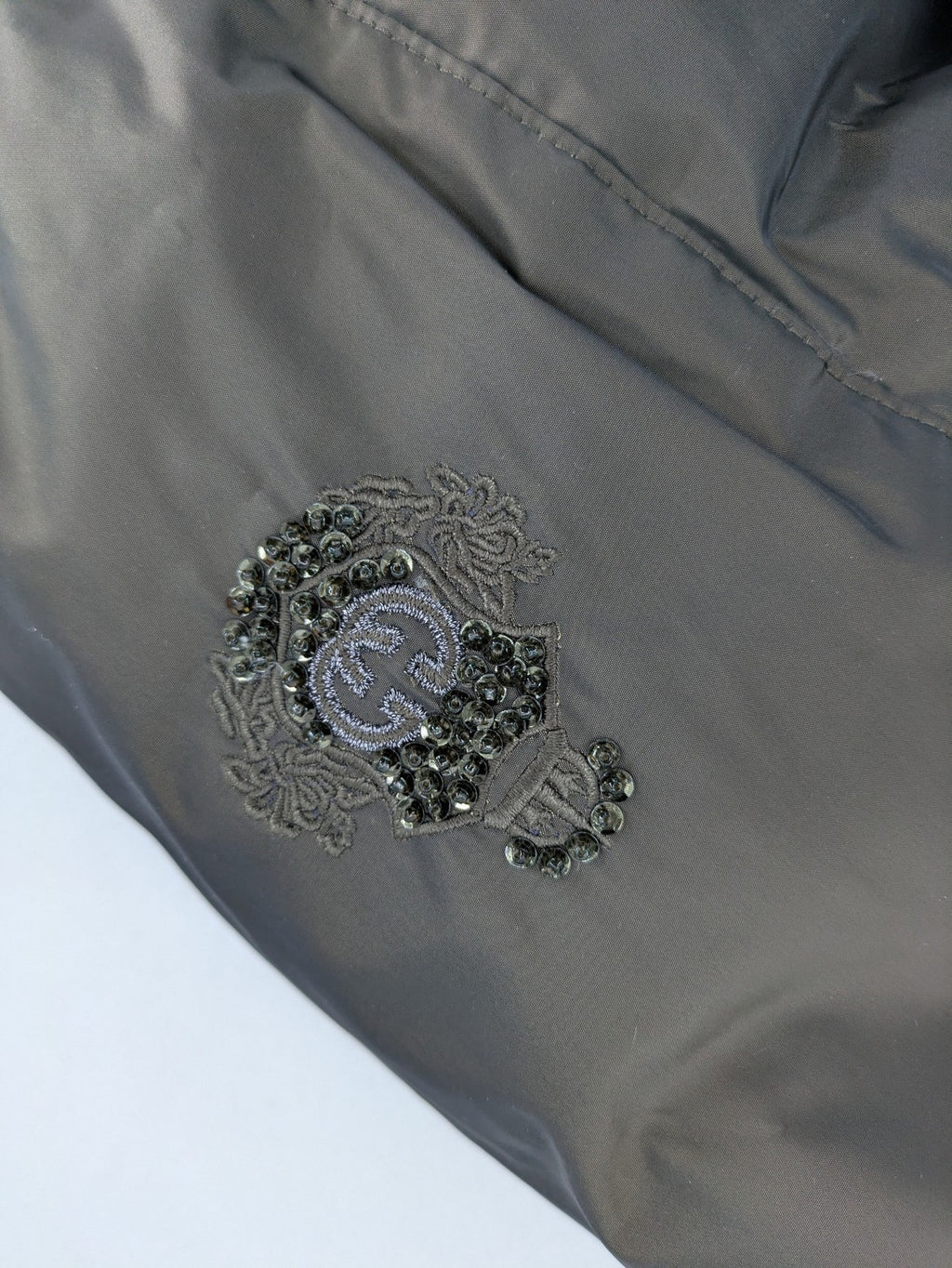 Gerry Weber Edition grey quilted coat with faux fur collar and metal toggle closures.