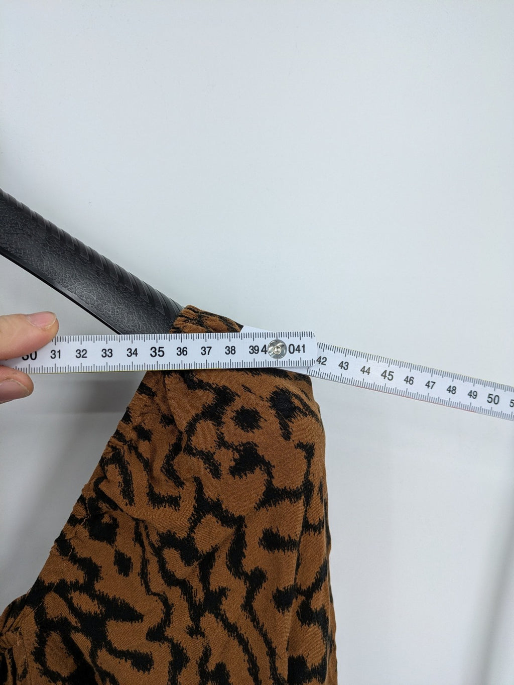 H&M brown and black animal print midi dress with smocked bodice and square neckline.
