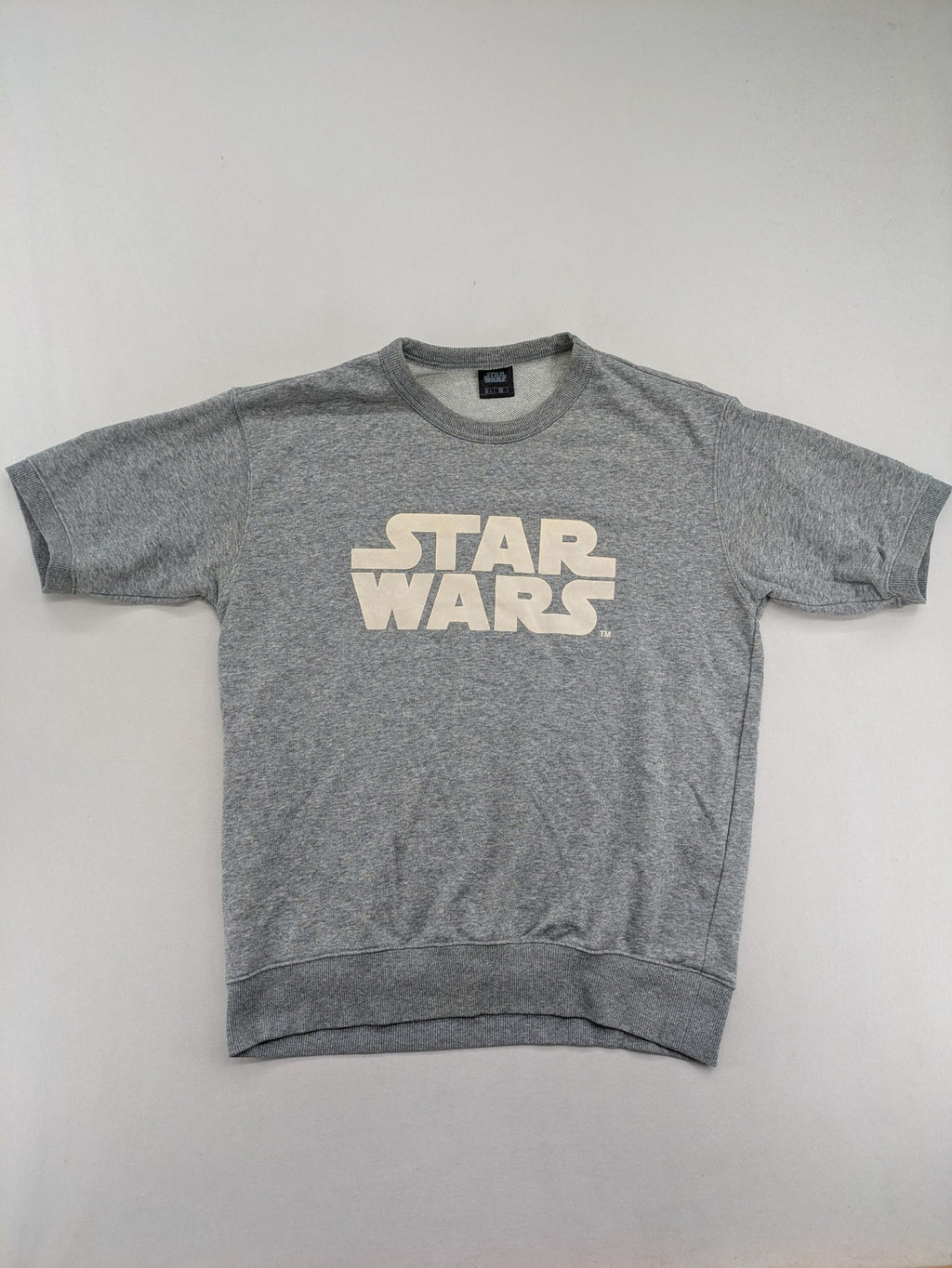 Star Wars grey short-sleeve sweatshirt with large cream logo print on chest.