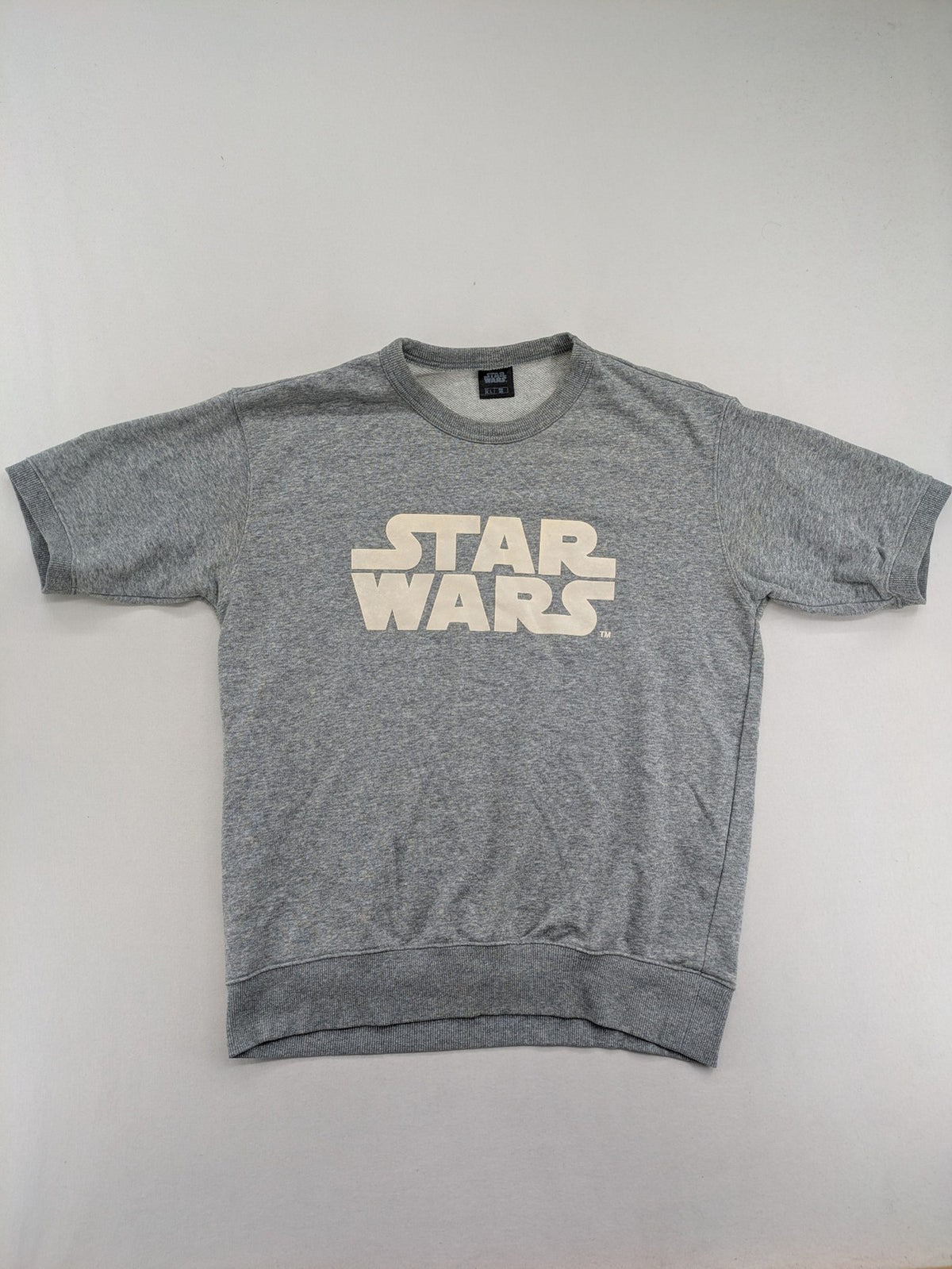Star Wars grey short-sleeve sweatshirt with large cream logo print on chest.