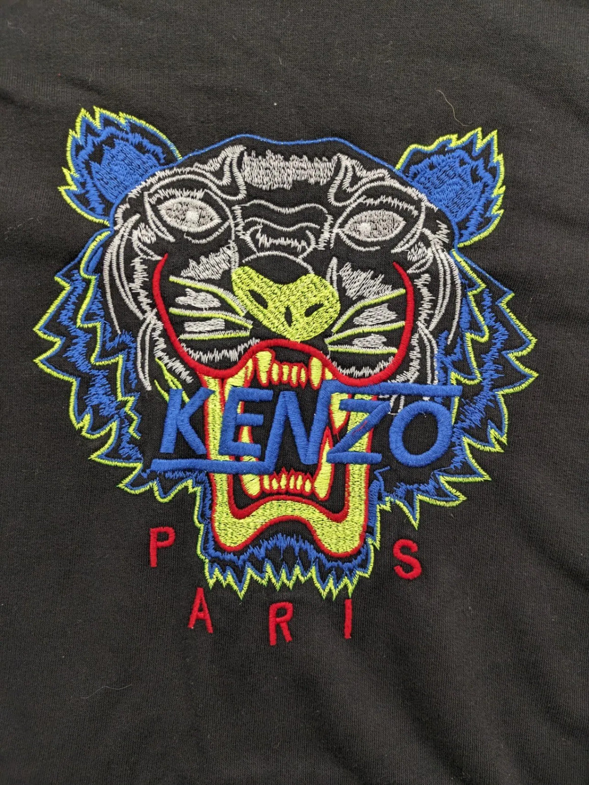 Kenzo multi hoodie with embroidered tiger graphic, drawstring hood, and kangaroo pocket.