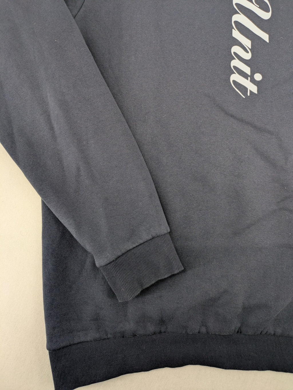 G-Unit navy turtle neck jumper with vertical logo graphic and soft fleece interior.