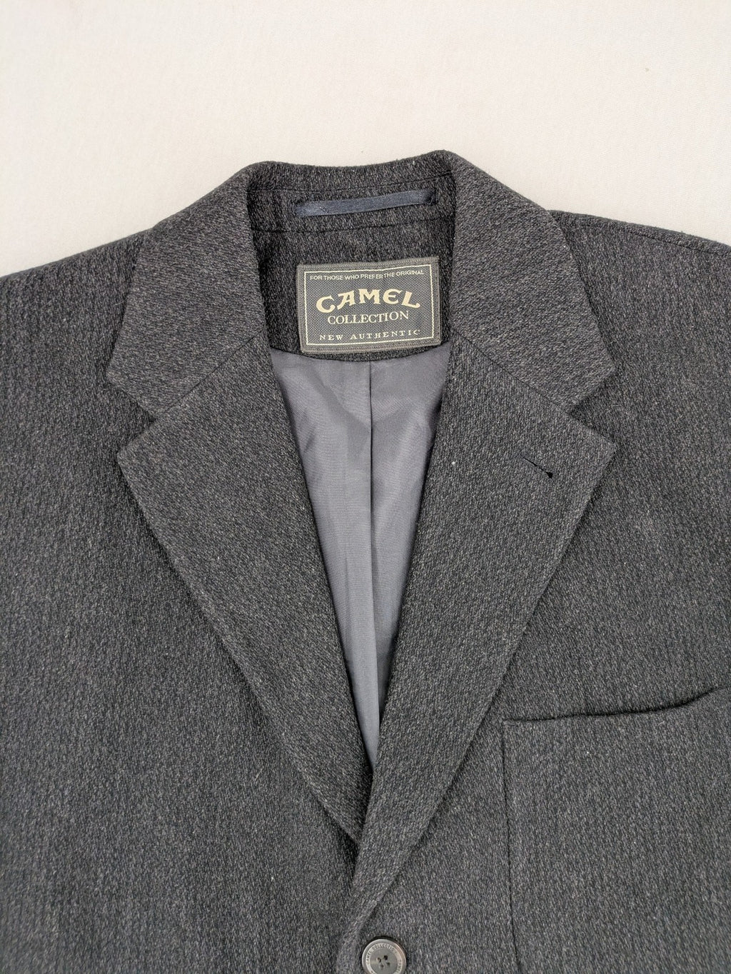 Camel Collection grey blazer three-button front with patch pockets, made from wool blend.