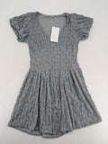 Zara grey mini dress with V-neck, puff sleeves, and textured fabric pattern.