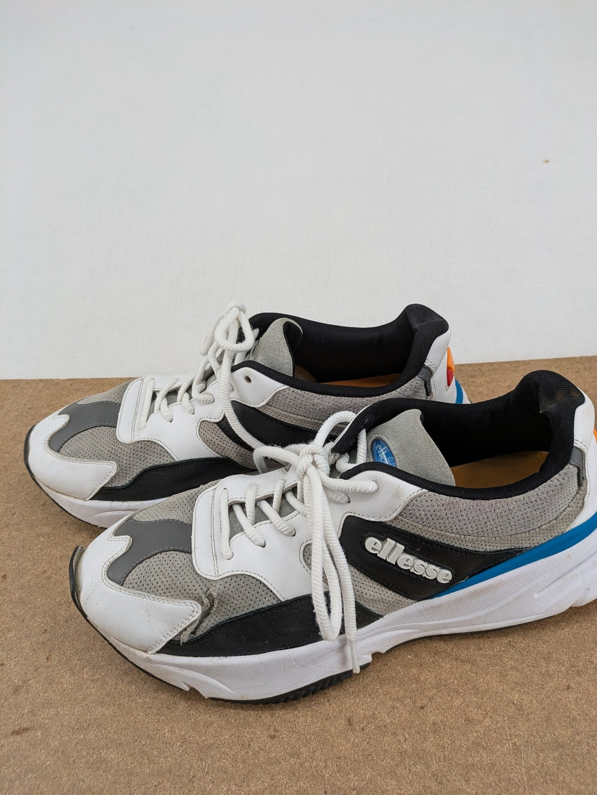 Ellesse Aurora chunky sneakers white grey with orange accents and multi-material upper.
