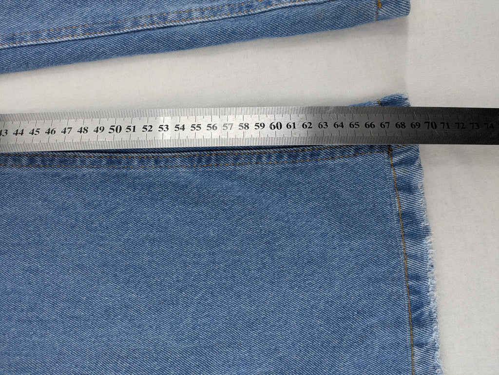 X.LOVE blue high waist wide leg jeans with front pleats and frayed hem.