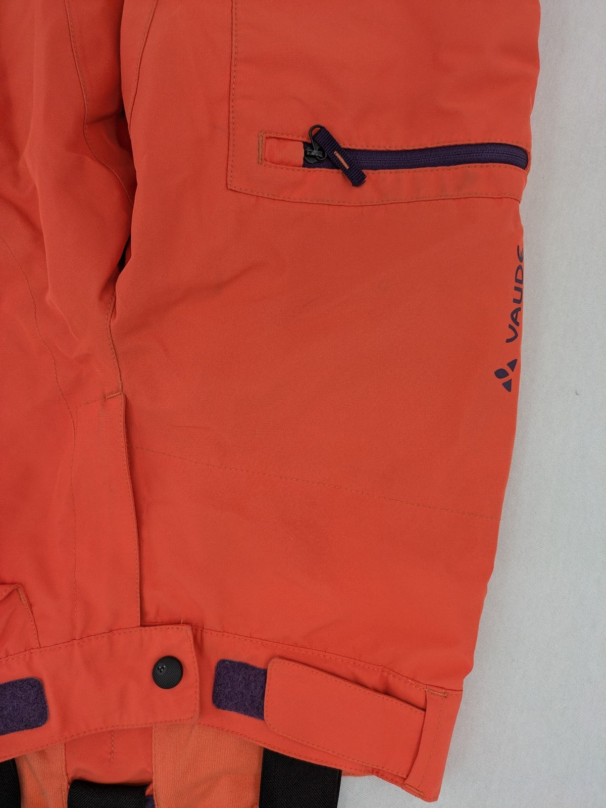 Vaude orange ski pants with logo, Primaloft insulation, and Ceplex Active membrane.