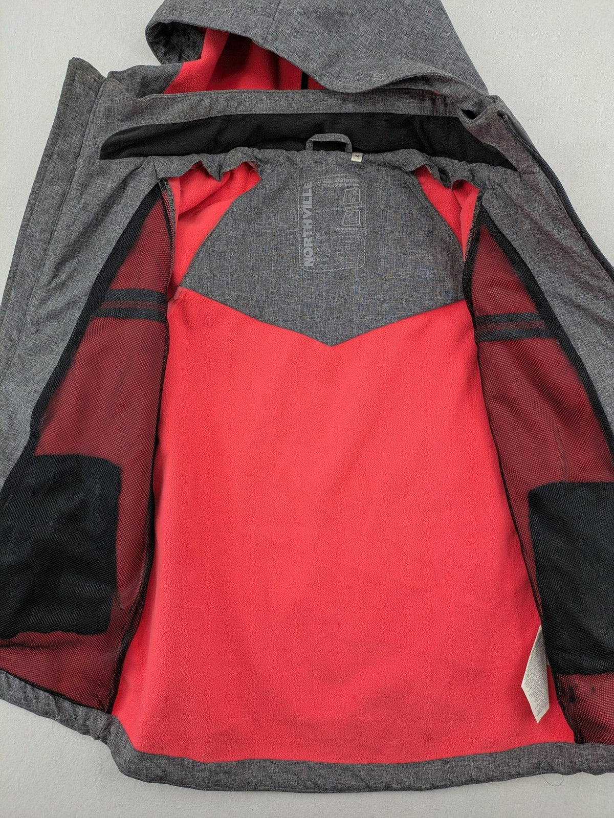 Northville grey and red softshell jacket with hood, fleece lining, and reflective elements.