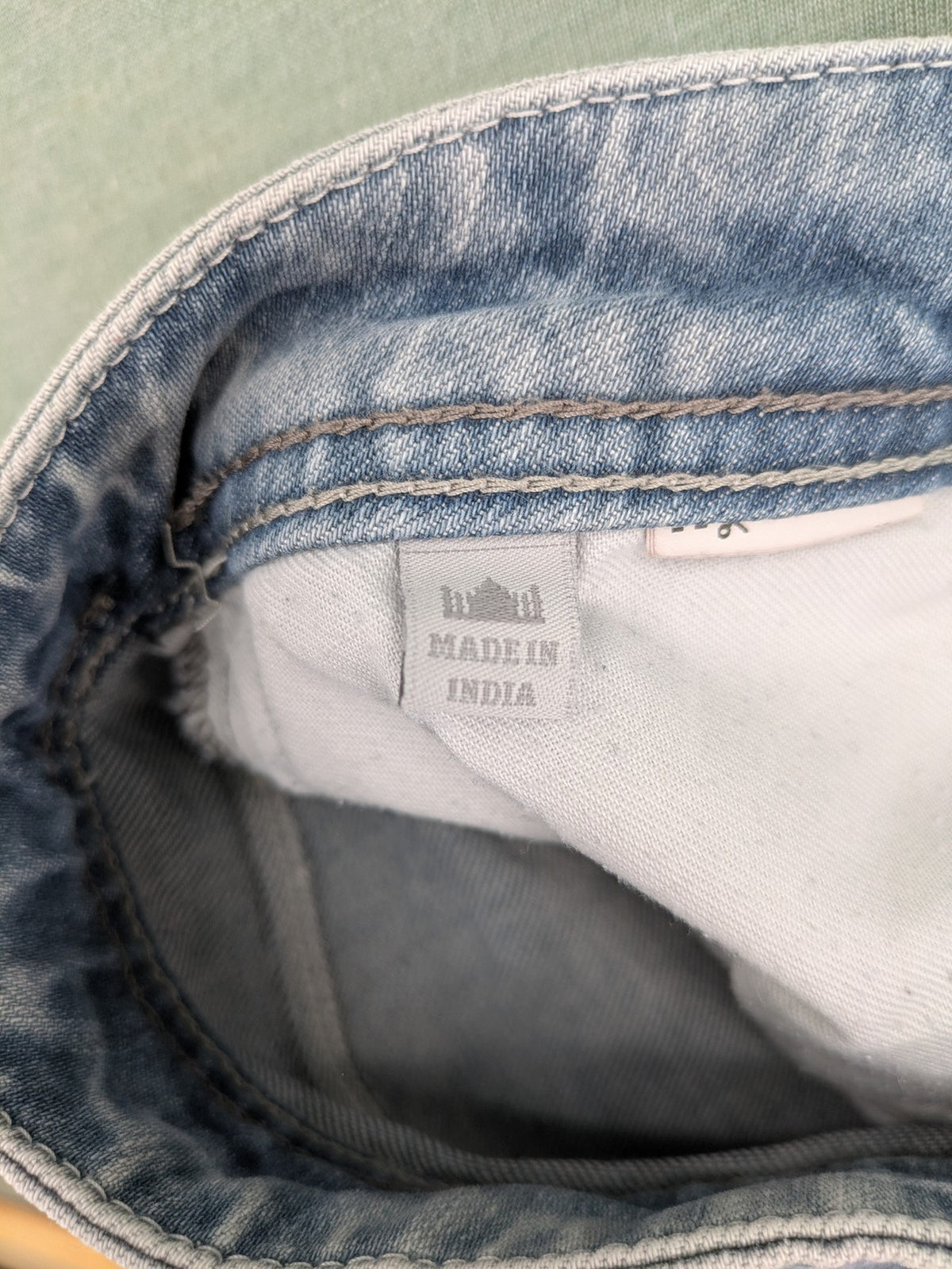 G-Star Raw blue straight leg jeans with classic 5-pocket design and light wash denim.