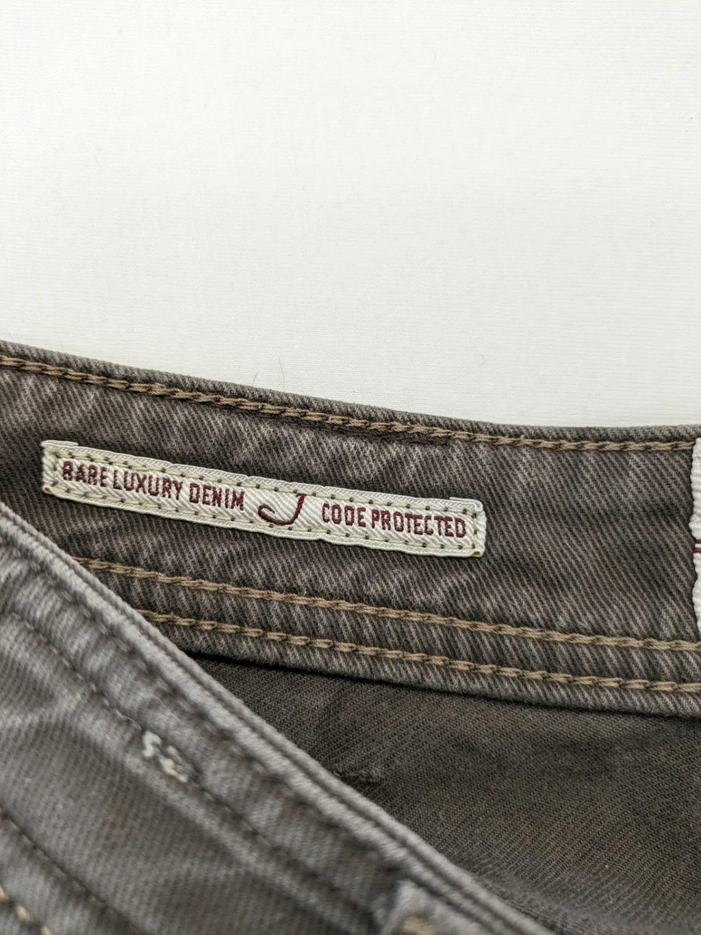 Jacob Cohen black straight jeans with leather logo patch and zip fly, size 32.