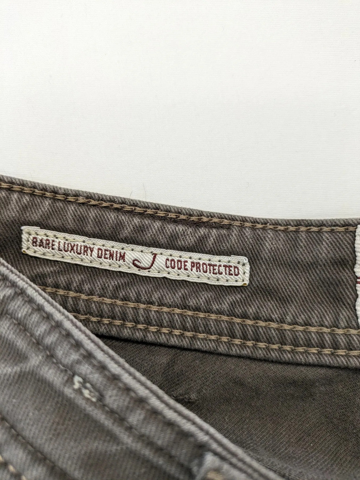 Jacob Cohen black straight jeans with leather logo patch and zip fly, size 32.