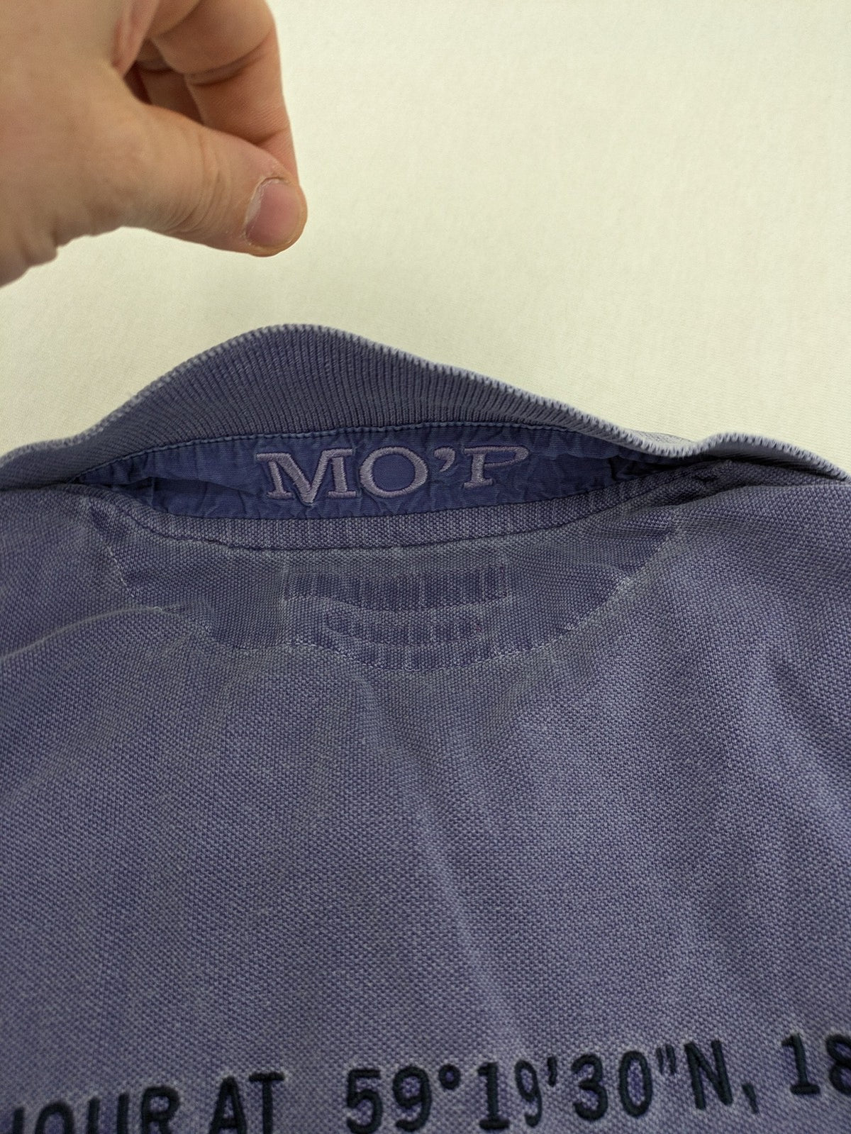 Marc O'Polo purple polo shirt garment dyed cotton with embroidered logo and intricate details.