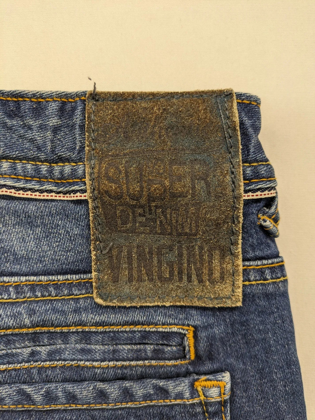 Vingino blue straight jeans medium wash 5-pocket design with zipper fly and stretch denim.