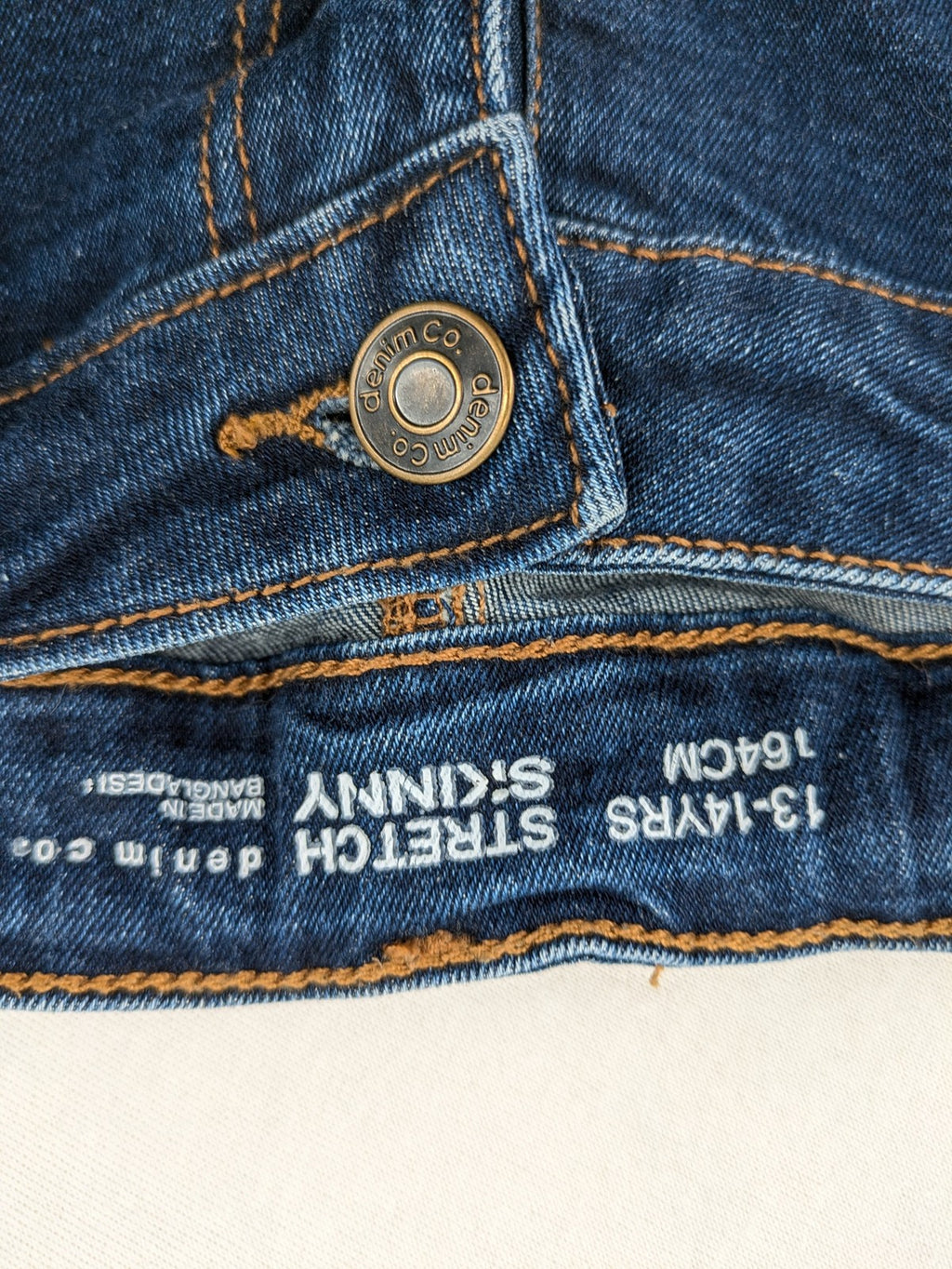 Denim & Co. blue skinny stretch jeans, five-pocket design, dark wash, durable material.