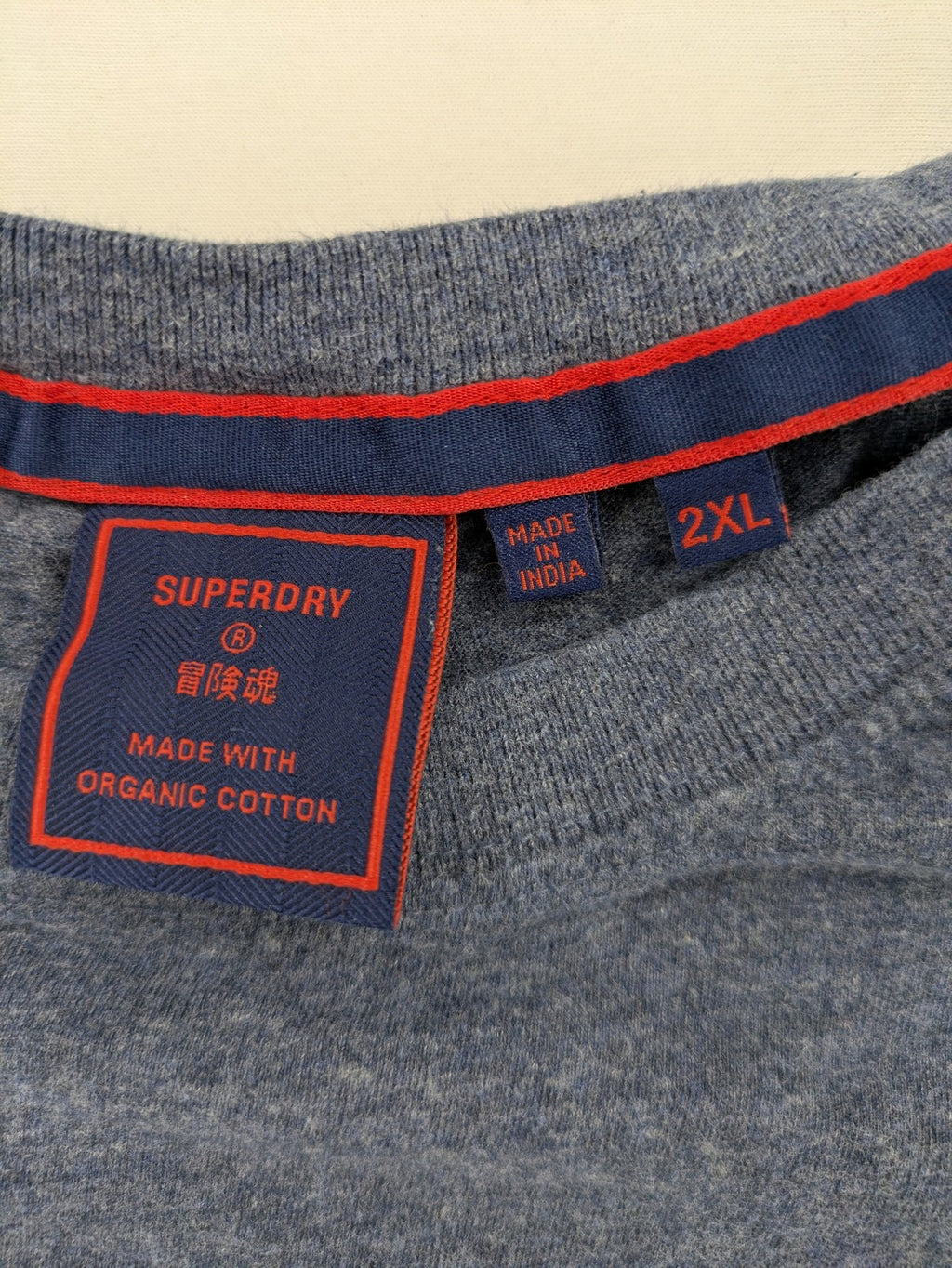 Superdry grey long sleeve shirt melange with embroidered logo and red collar accent.