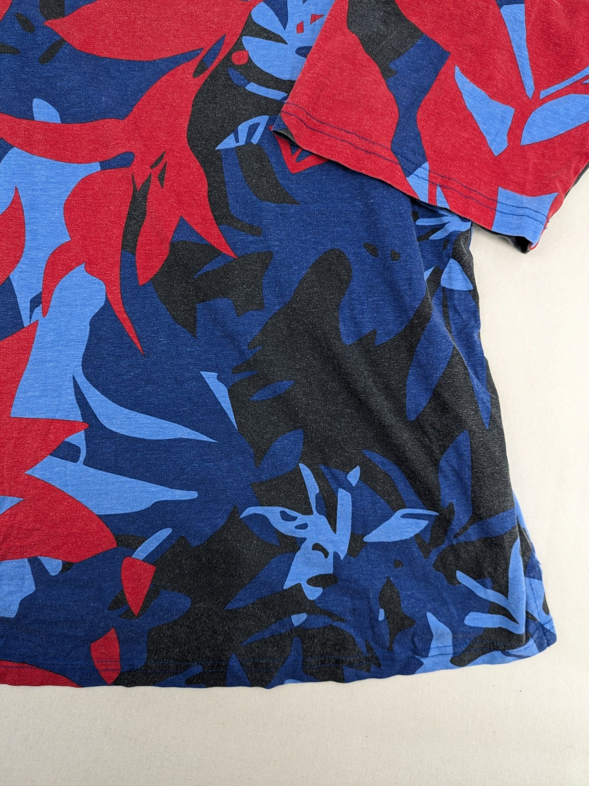 Ulla Popken blue top with floral print, V-neck, 3/4 sleeves, soft cotton blend.