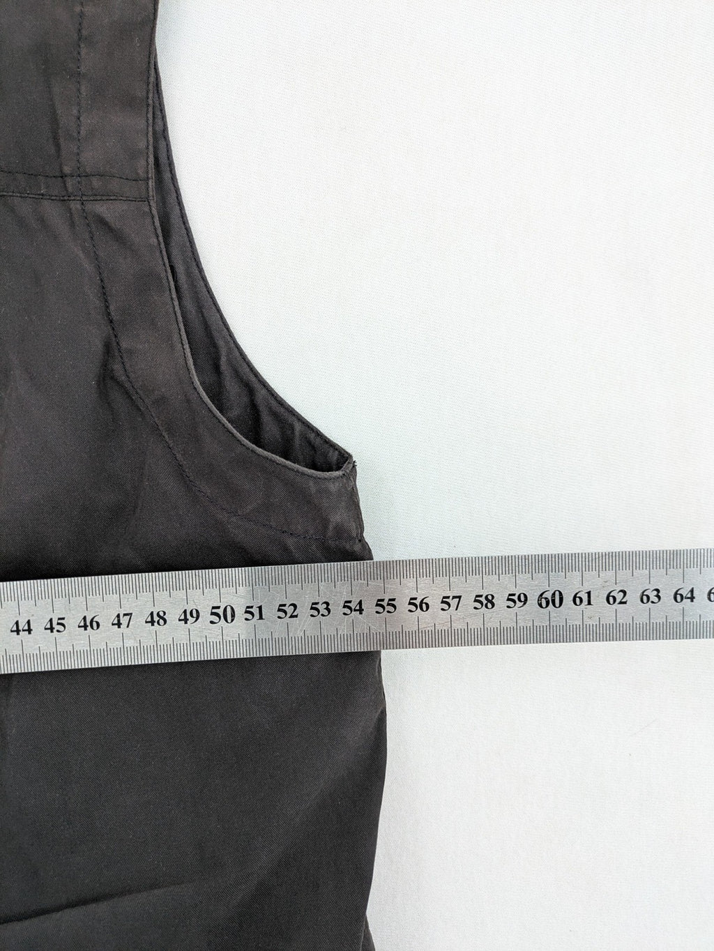 Barisal grey coat with hood, cargo pockets, and checkered lining detail.