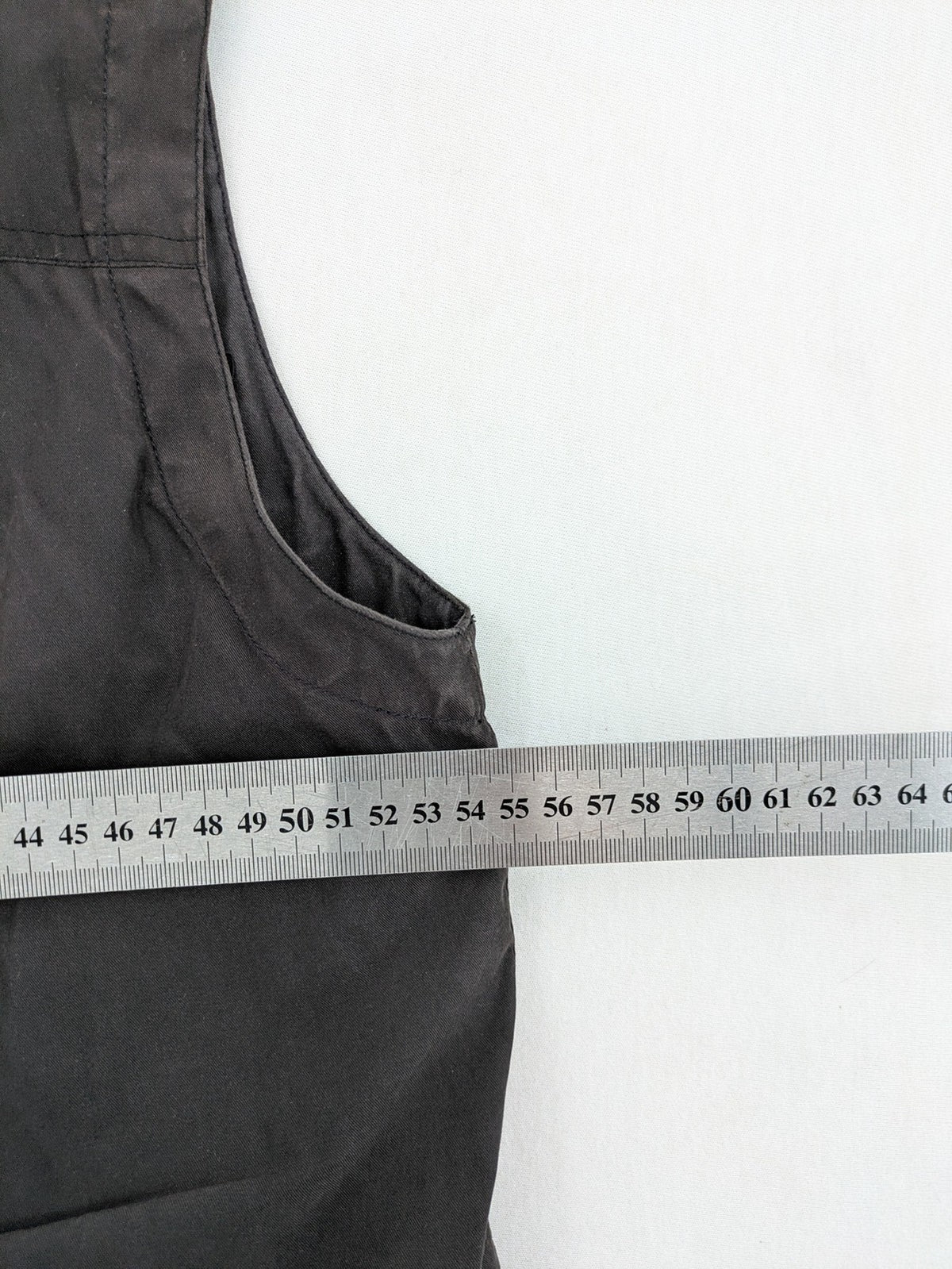 Barisal grey coat with hood, cargo pockets, and checkered lining detail.