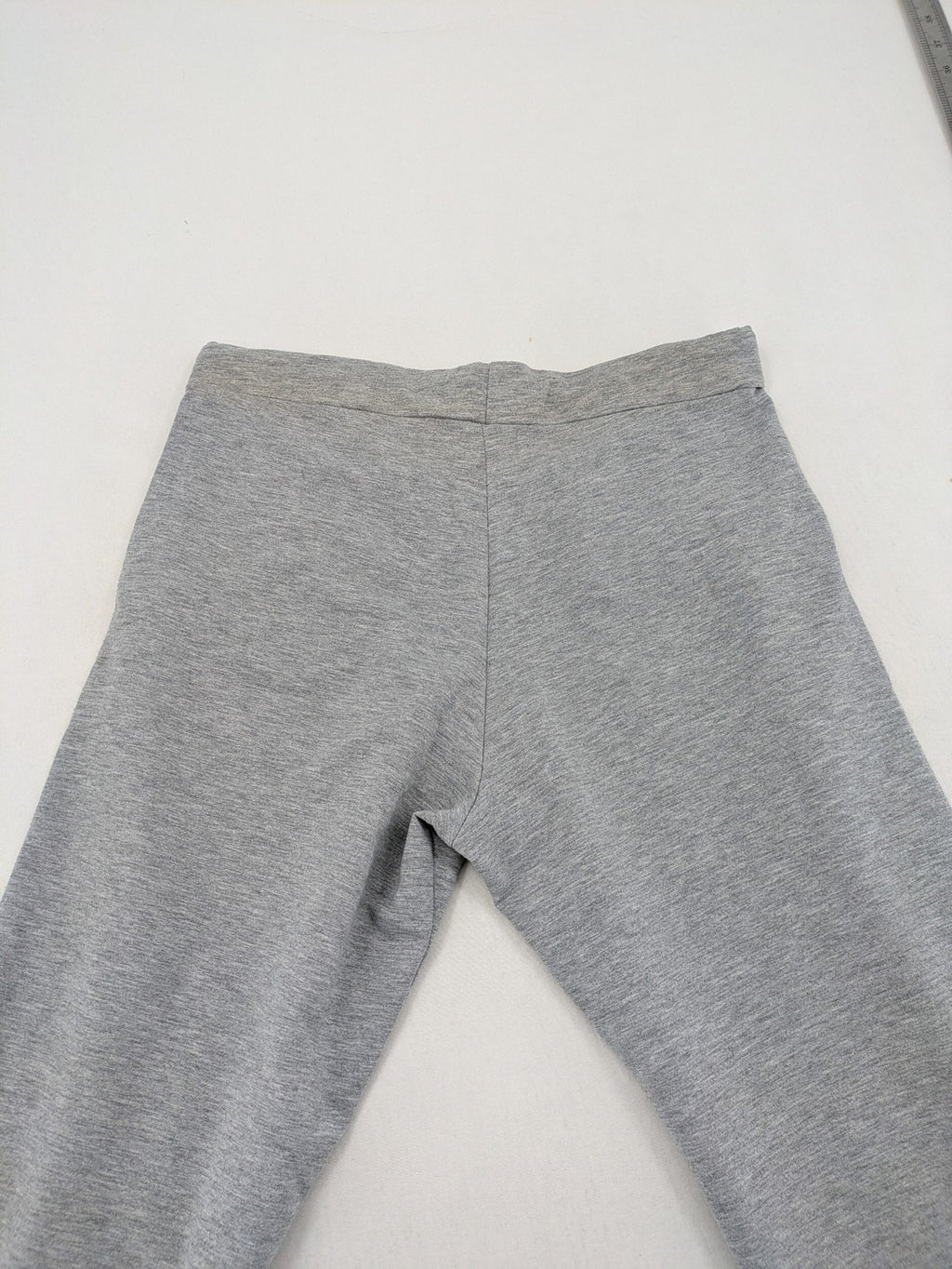 Falconhill grey jogging pants with elastic waistband, drawstring, and stylish black accent pockets.