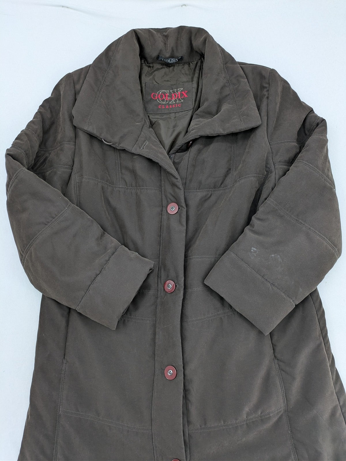 Goldix brown puffer coat size 46, button closure, padded design, classic style.