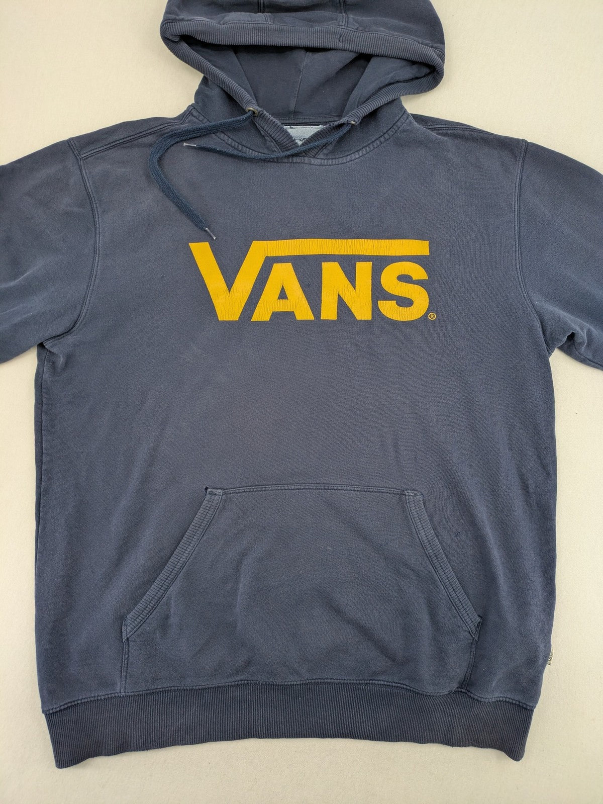 Vans zip-through hoodie navy blue with large yellow logo and kangaroo pocket.