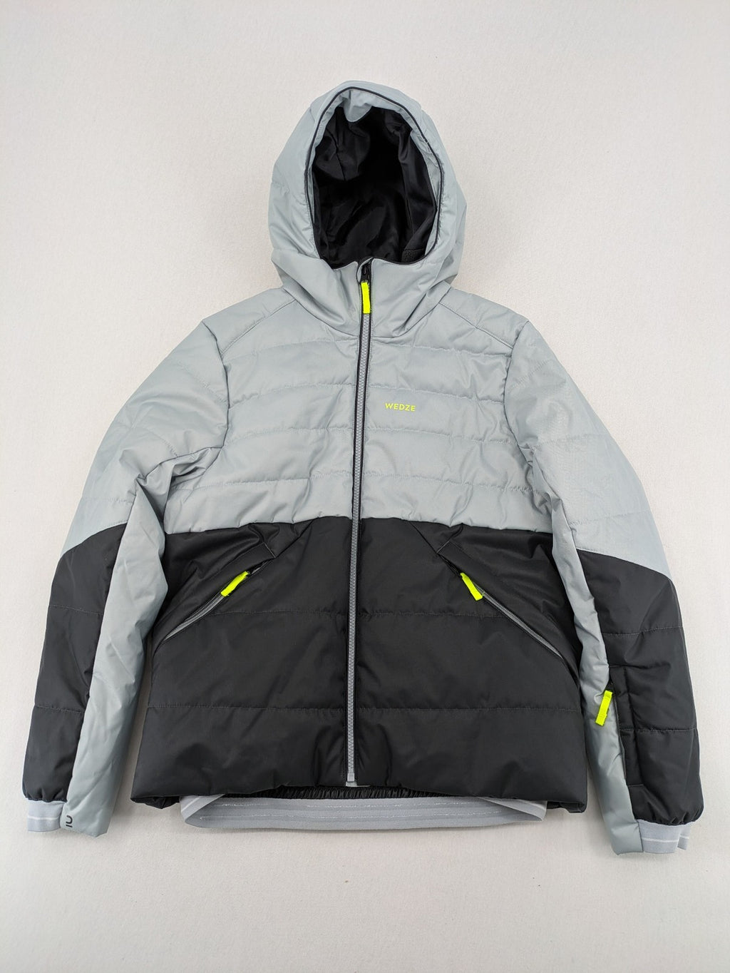 Wedze ski coat grey and black colorblock design with neon accents and fleece lining.