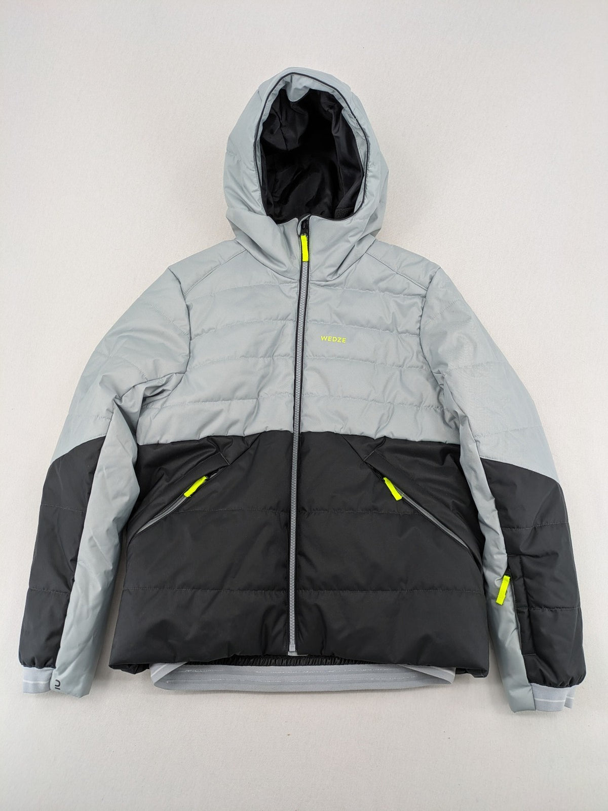 Wedze ski coat grey and black colorblock design with neon accents and fleece lining.