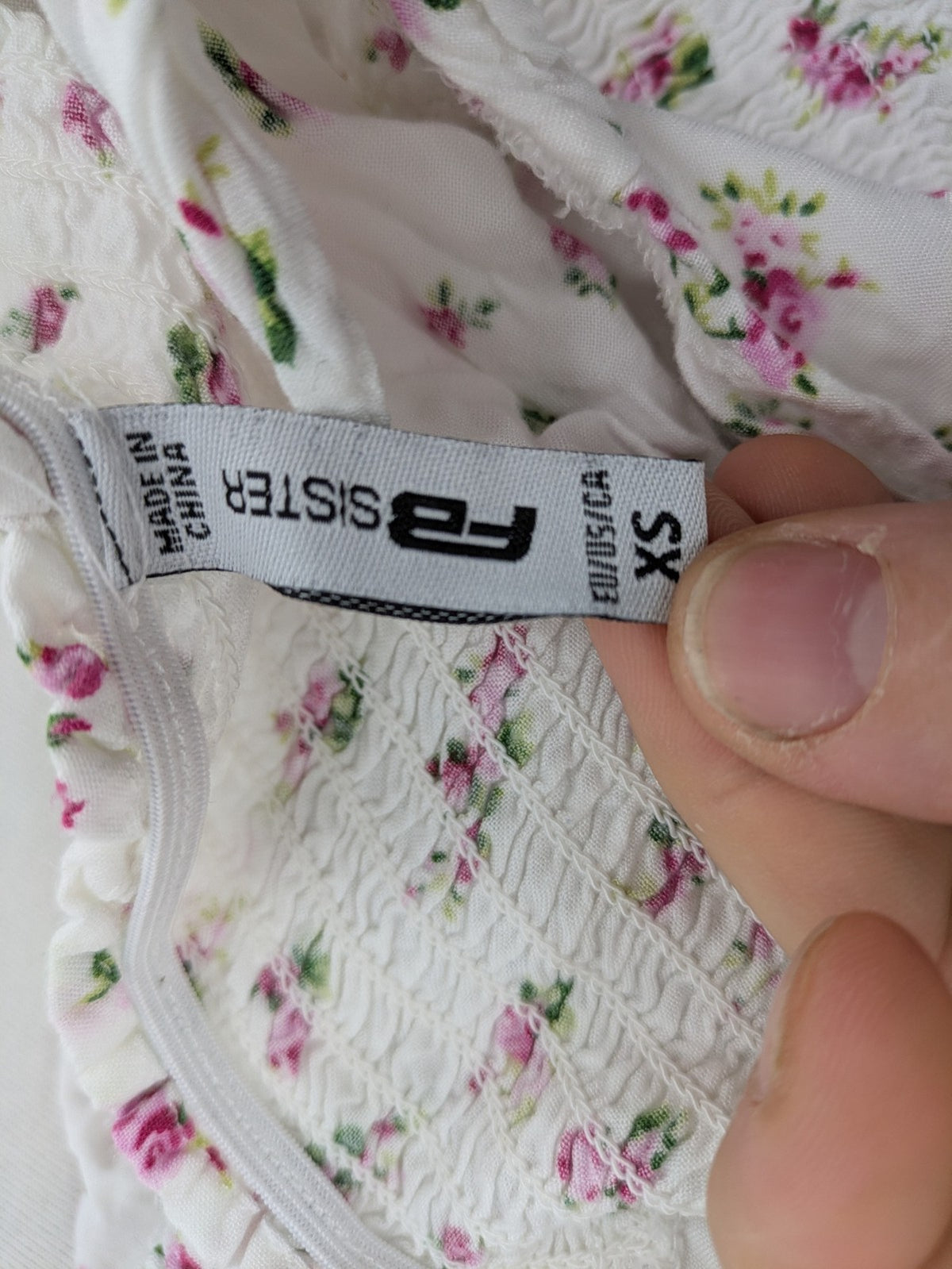 FB Sister floral playsuit white with pink flowers, smocked bodice, lightweight viscose material.
