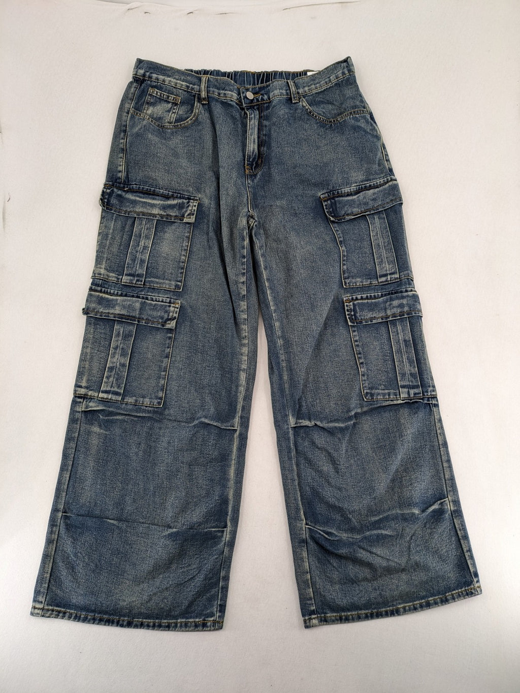 Baggy blue straight jeans wide leg with cargo pockets and elastic waistband.