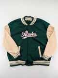 Shein Curve beige bomber jacket with green "Alaska" embroidery and striped ribbed cuffs.