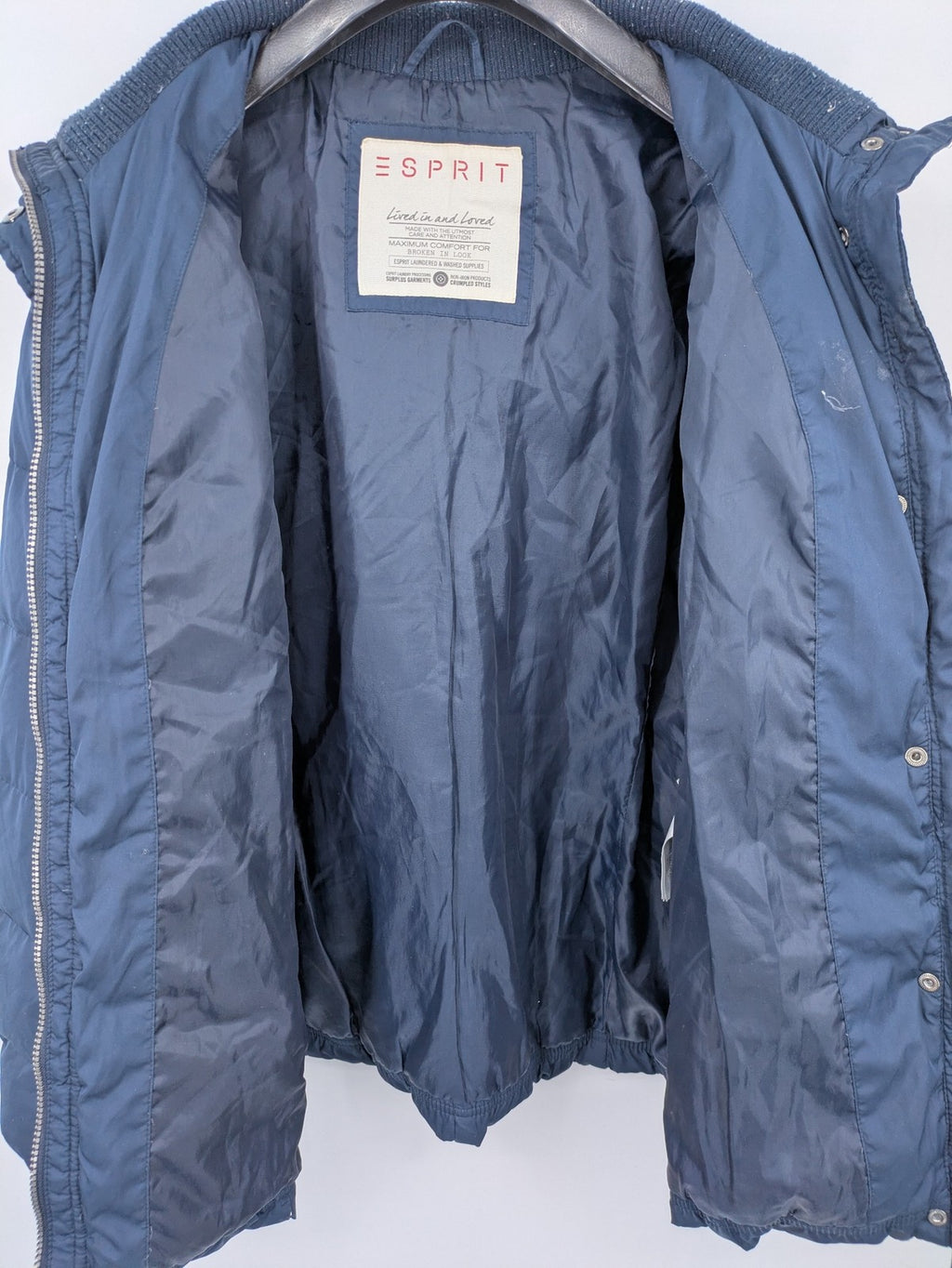Esprit navy puffer jacket with belt, high collar, ribbed inner lining, and button placket.
