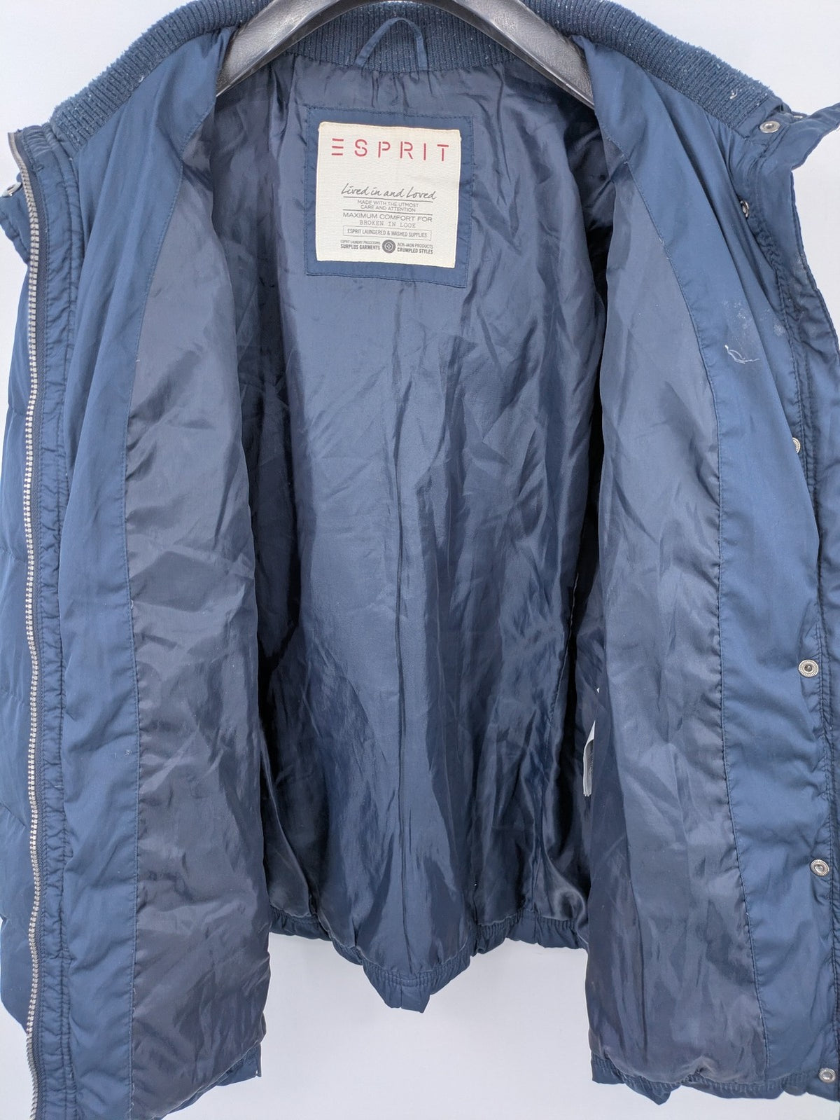 Esprit navy puffer jacket with belt, high collar, ribbed inner lining, and button placket.